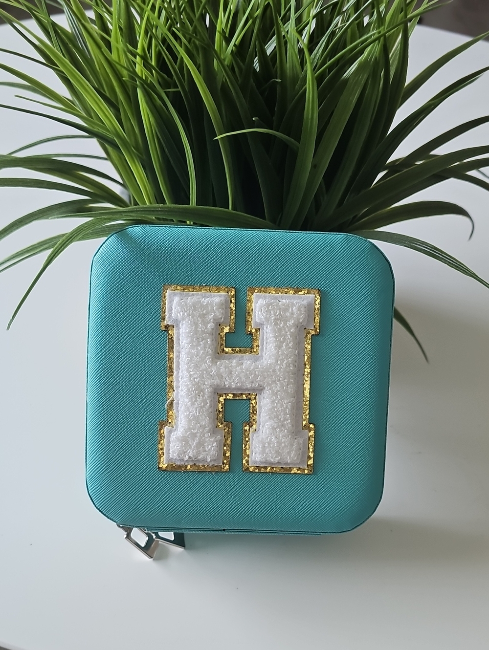 Teal Square Jewelry Case with White 'H' Patch
